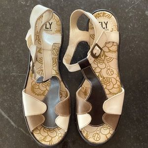 Fly London wedges, black, brown, and white.